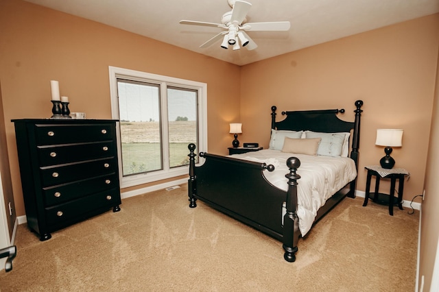 241 Cottonwood Cv, Lynd, MN 56157 - bedroom featuring baseboards, carpet flooring, ceiling fan, and visible vents