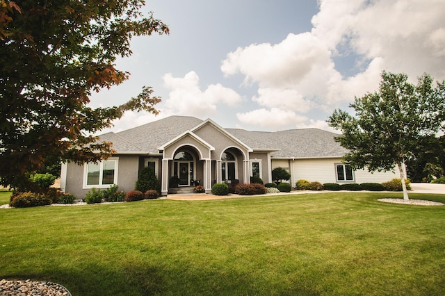 241 Cottonwood Cv, Lynd, MN 56157 - ranch-style house featuring roof with shingles and a front lawn