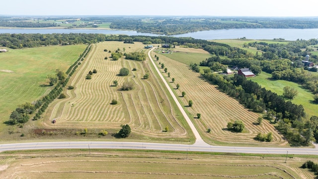 birds eye view of property featuring a water view and a rural view