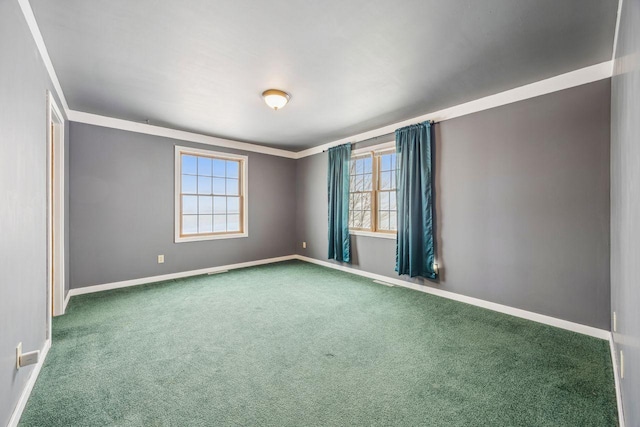carpeted spare room with baseboards
