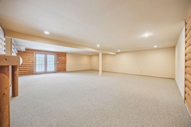 basement featuring carpet flooring, baseboards, and recessed lighting