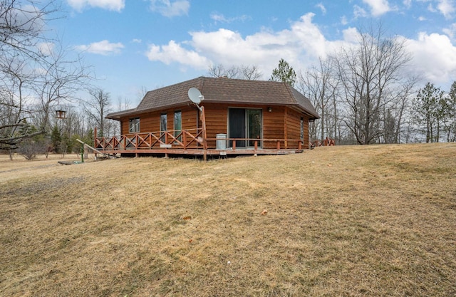 34130 Deer Lake Rd, Grand Rapids, MN 55744 - view of front of house featuring roof with shingles, a front yard, and a deck