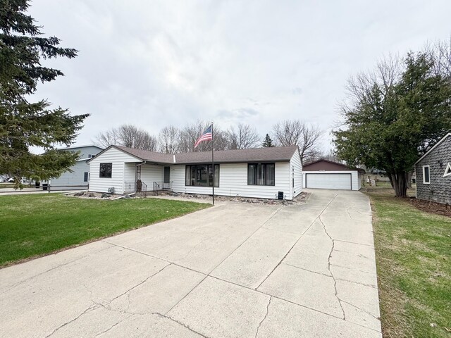 1525 Shore Dr, Worthington, MN 56187 - ranch-style house featuring a front lawn, an outbuilding, and a detached garage