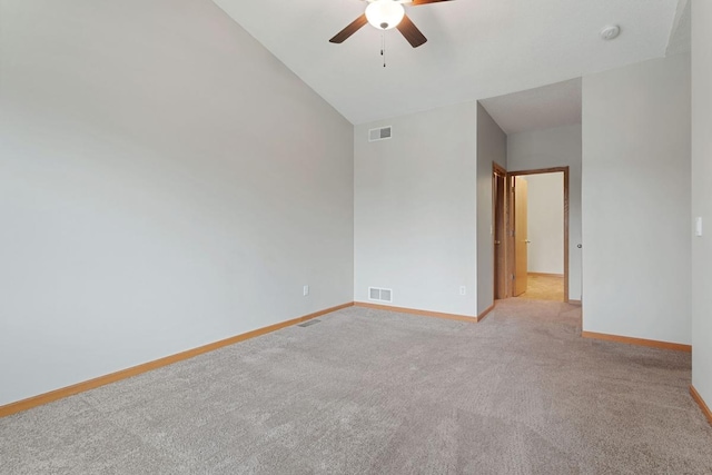 unfurnished room with ceiling fan, baseboards, light carpet, lofted ceiling, and a smoke detector