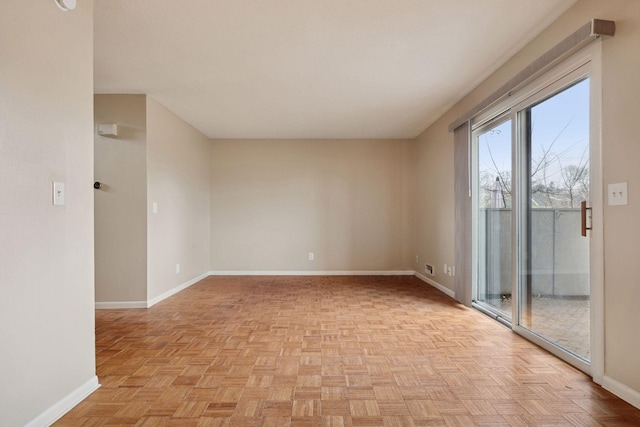 empty room featuring baseboards
