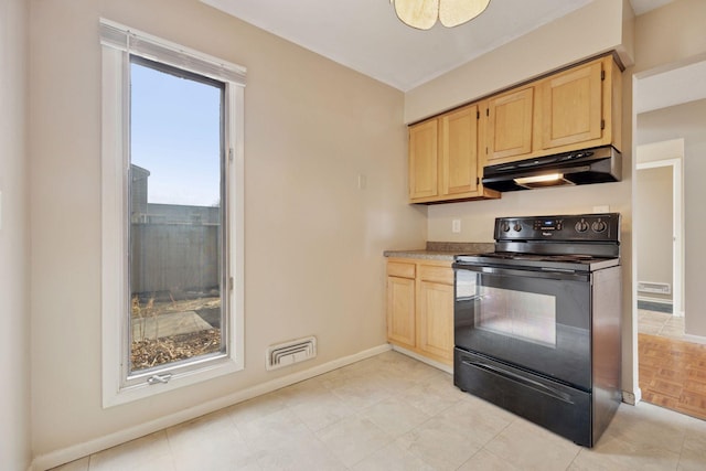 kitchen with visible vents, baseboards, black range with electric cooktop, light brown cabinets, and under cabinet range hood