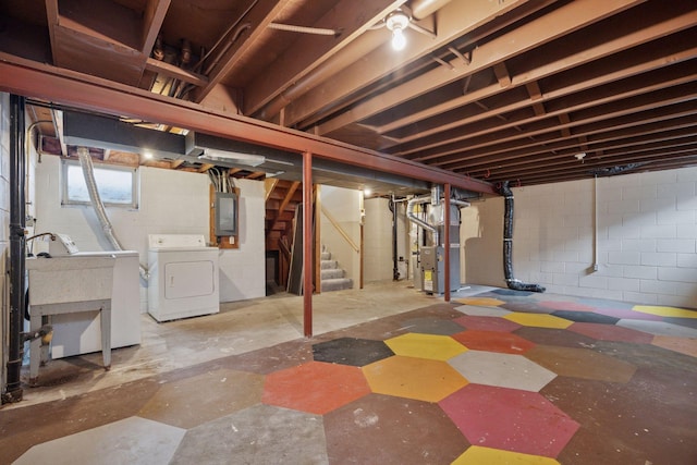 below grade area featuring a sink, heating unit, electric panel, and stairs