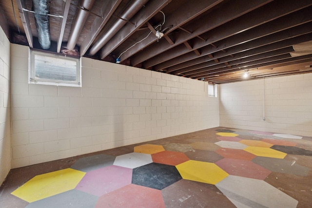 below grade area featuring tile patterned floors and plenty of natural light