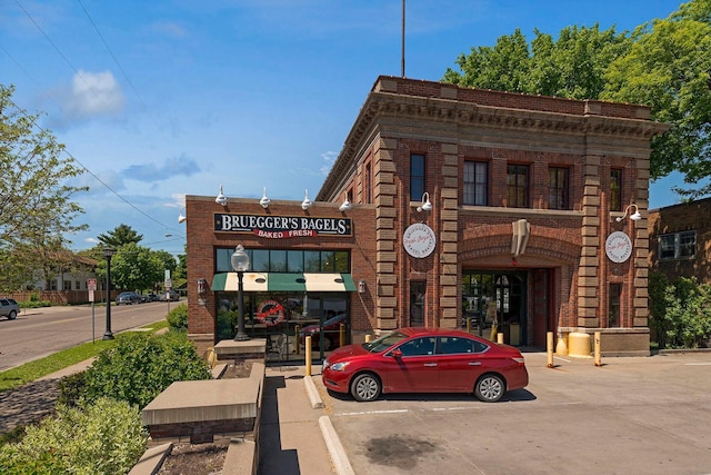 view of property with uncovered parking