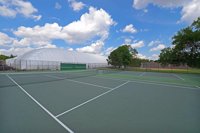 view of sport court featuring community basketball court and fence
