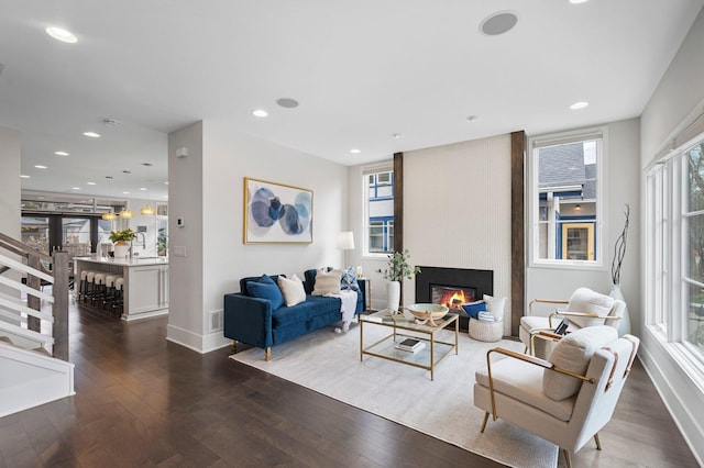5231 Washburn Ave S, Minneapolis, MN 55410 - living room with dark wood finished floors, a large fireplace, baseboards, and recessed lighting