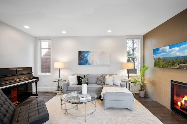 5231 Washburn Ave S, Minneapolis, MN 55410 - living area featuring a tile fireplace, wood finished floors, plenty of natural light, recessed lighting, and baseboards