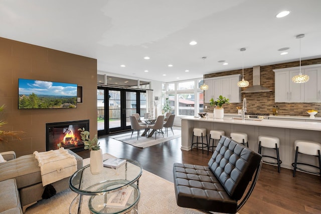 5231 Washburn Ave S, Minneapolis, MN 55410 - living area featuring dark wood finished floors, recessed lighting, and a glass covered fireplace