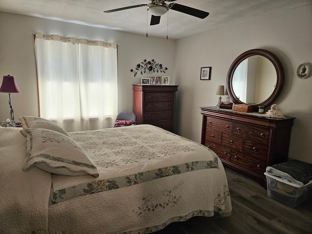 bedroom featuring a ceiling fan and wood finished floors