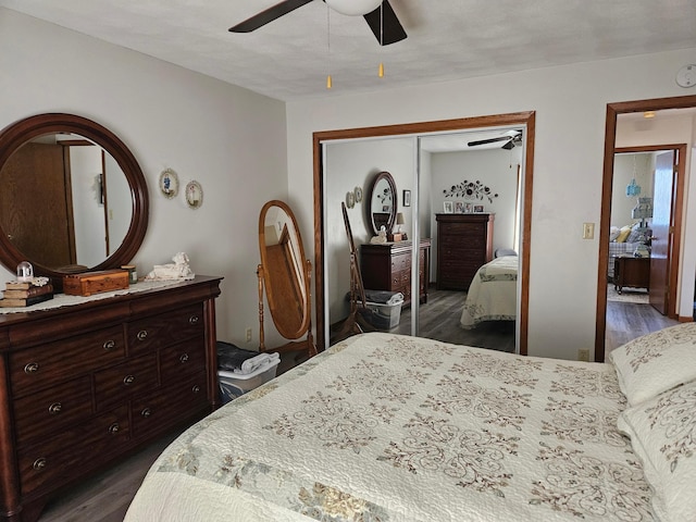 bedroom featuring a closet, ceiling fan, and dark wood-style flooring