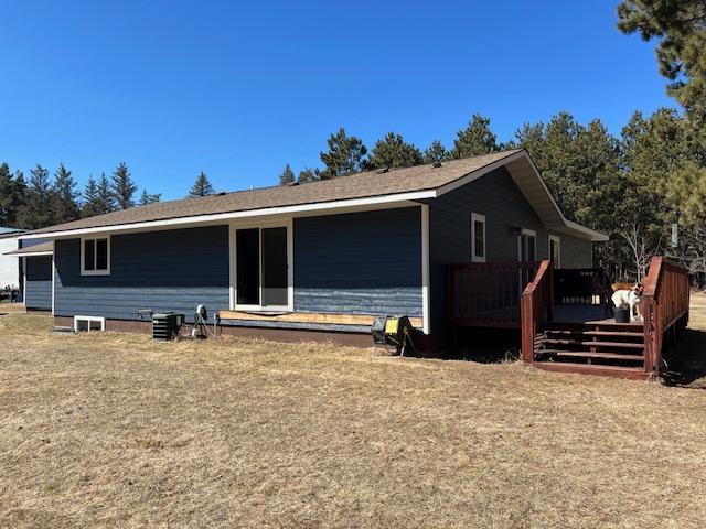 back of house featuring a deck