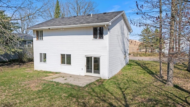 1607 7th Ave, Grand Rapids, MN 55744 - back of house with a yard, a patio area, and roof with shingles