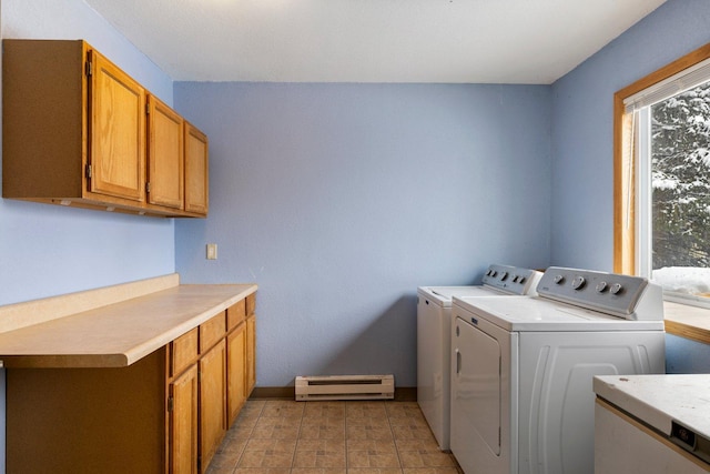 1607 7th Ave, Grand Rapids, MN 55744 - washroom featuring a baseboard heating unit, washing machine and dryer, cabinet space, and baseboards