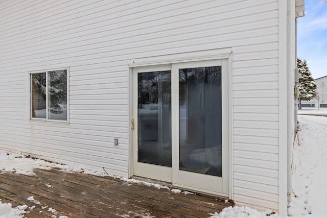 1607 7th Ave, Grand Rapids, MN 55744 - view of snowy exterior featuring a deck
