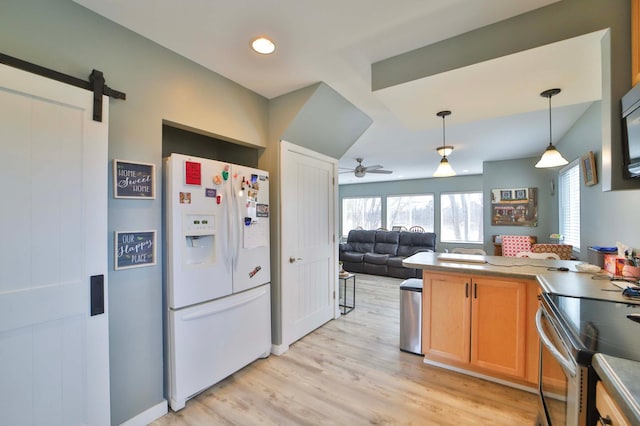 kitchen featuring light wood-type flooring, stainless steel electric range, white fridge with ice dispenser, open floor plan, and ceiling fan