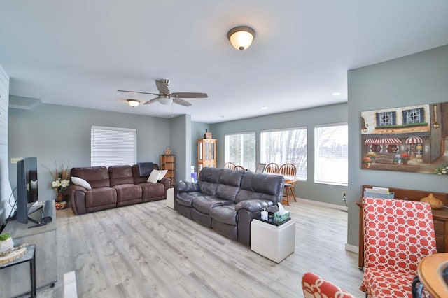 living area featuring baseboards, a ceiling fan, wood finished floors, and recessed lighting