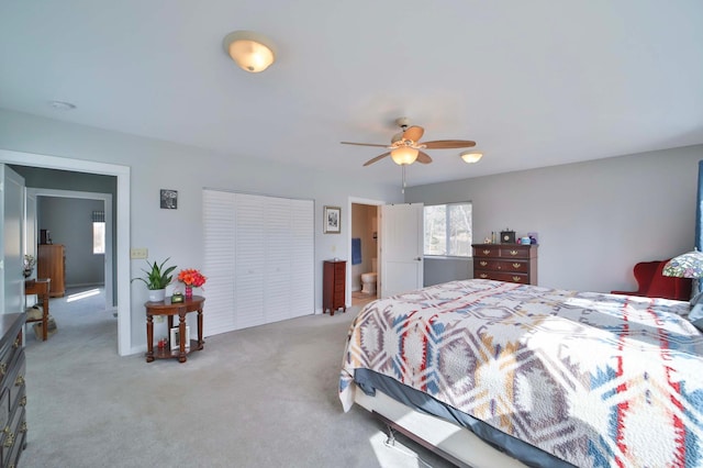 bedroom featuring a ceiling fan and light colored carpet