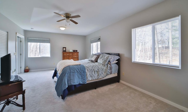 bedroom with baseboards, carpet flooring, and ceiling fan