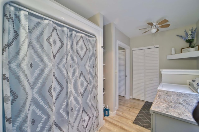 interior space with a ceiling fan and wood finished floors