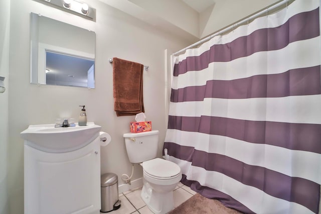 bathroom with toilet, a shower with curtain, vanity, and tile patterned floors