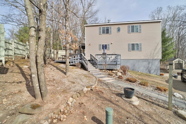 back of property featuring a wooden deck