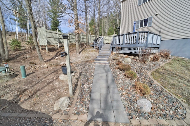 view of home's exterior with stairway and a deck