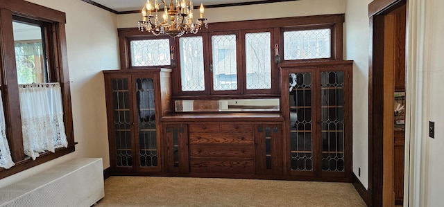 502 Park St S, Fairfax, MN 55332 - interior space with carpet flooring, a chandelier, plenty of natural light, ornamental molding, and a wall mounted air conditioner