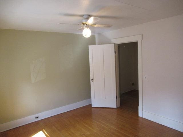 502 Park St S, Fairfax, MN 55332 - spare room with baseboards, ceiling fan, and wood finished floors