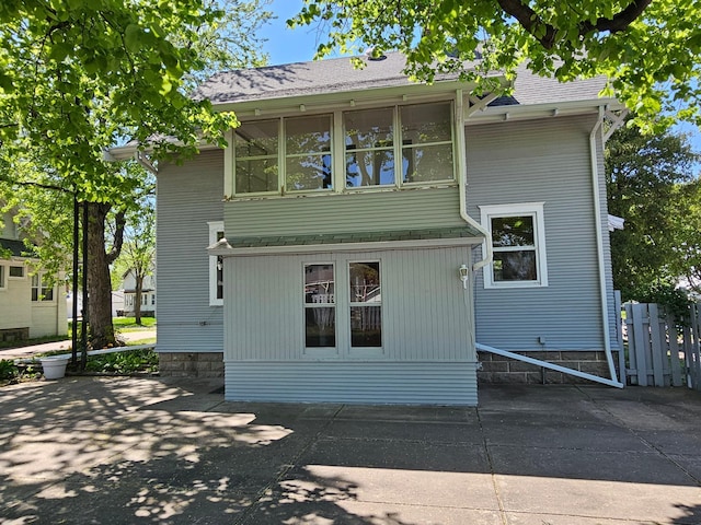 502 Park St S, Fairfax, MN 55332 - rear view of property featuring fence and a patio