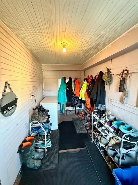 mudroom with wood ceiling