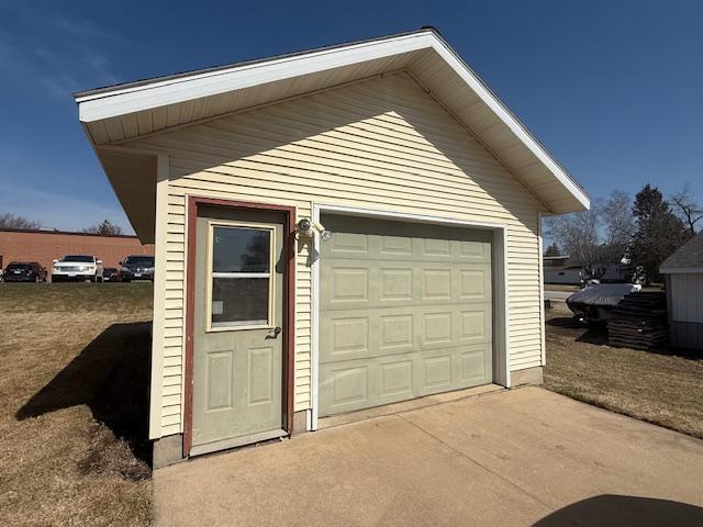 detached garage featuring driveway