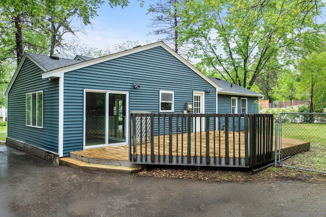 3401 Meadow Ln, Minnetonka, MN 55345 - back of house with a deck and a shingled roof