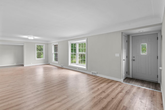 3401 Meadow Ln, Minnetonka, MN 55345 - unfurnished living room featuring light wood-style floors and baseboards