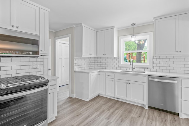 3401 Meadow Ln, Minnetonka, MN 55345 - kitchen with stainless steel appliances, a sink, tasteful backsplash, light countertops, and ornamental molding