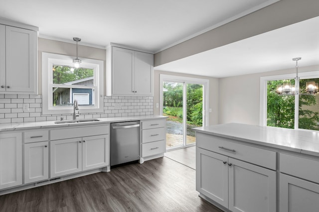 3401 Meadow Ln, Minnetonka, MN 55345 - kitchen with dishwasher, a sink, decorative backsplash, dark wood-style flooring, and hanging light fixtures