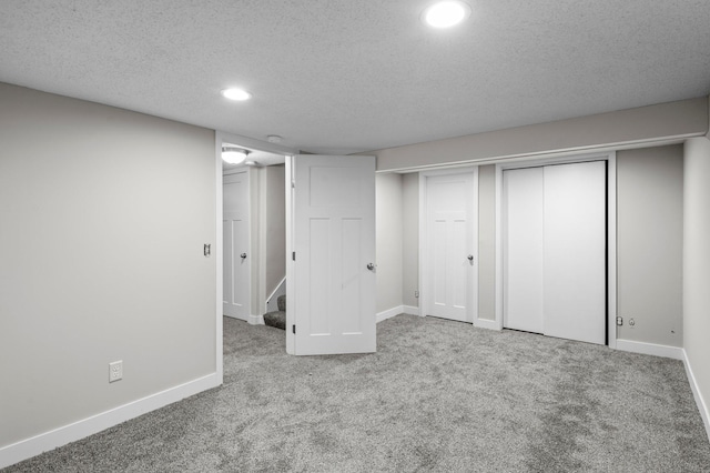 3401 Meadow Ln, Minnetonka, MN 55345 - finished basement featuring carpet floors, a textured ceiling, recessed lighting, and baseboards