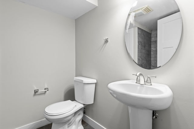 3401 Meadow Ln, Minnetonka, MN 55345 - half bath with baseboards, toilet, and a sink