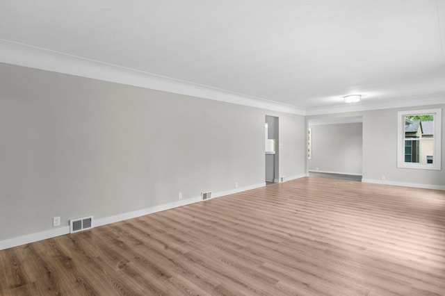 3401 Meadow Ln, Minnetonka, MN 55345 - spare room featuring wood finished floors, baseboards, and crown molding