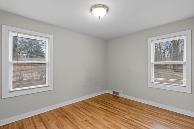 3401 Meadow Ln, Minnetonka, MN 55345 - spare room with plenty of natural light, baseboards, and light wood-type flooring