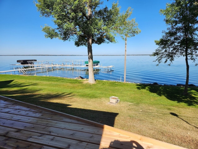 dock area featuring a yard and a water view