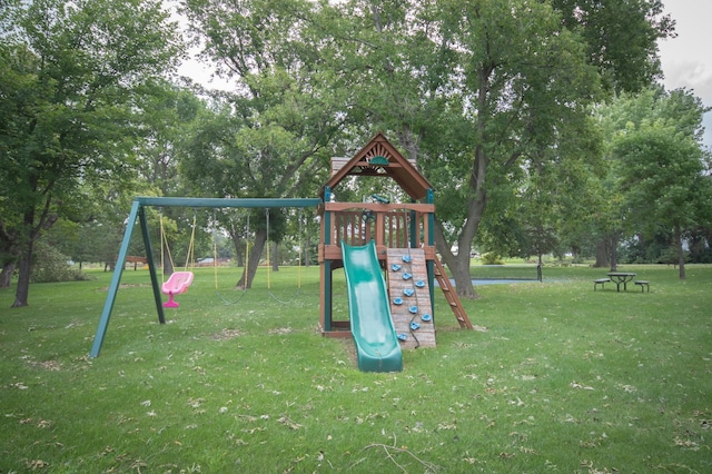 community jungle gym with a lawn