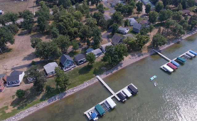 birds eye view of property featuring a water view and a residential view