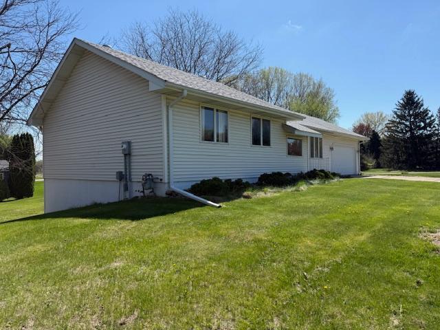 7996 Corey Path, Inver Grove Heights, MN 55076 - view of property exterior with an attached garage and a yard