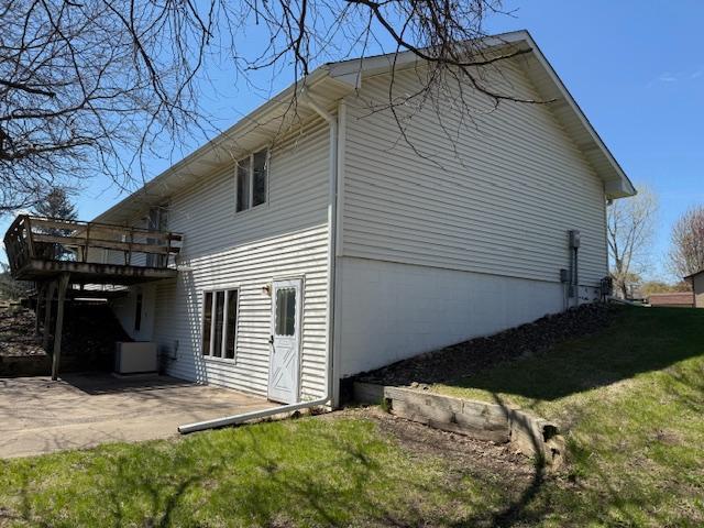 7996 Corey Path, Inver Grove Heights, MN 55076 - view of side of property featuring a patio, a deck, and a lawn
