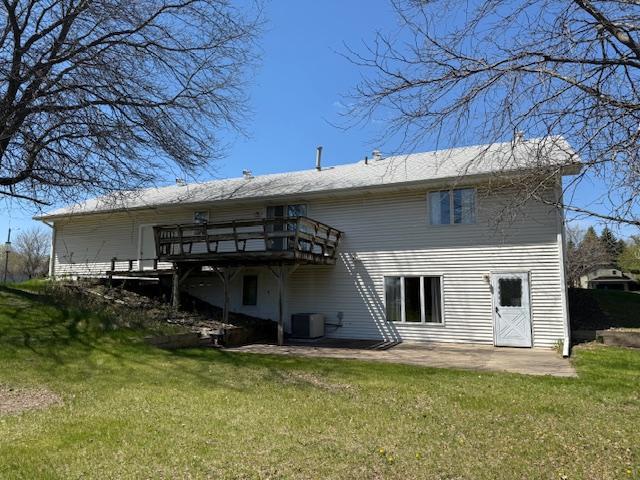 7996 Corey Path, Inver Grove Heights, MN 55076 - rear view of property featuring a yard, central AC, a deck, and a patio